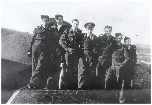 Crew Beattie - standing on wing of Halifax - RCAF