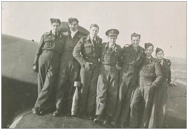 Crew Beattie - standing on wing of Halifax - RCAF