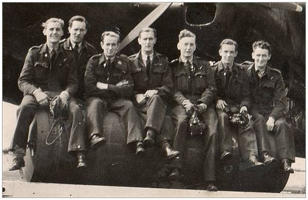 Shorter (F), Race (A), Sloan (A), Rule (P), Manley (S), Reeves (N) and Coyne (W) in front of Lancaster K2 - likely summer 1943