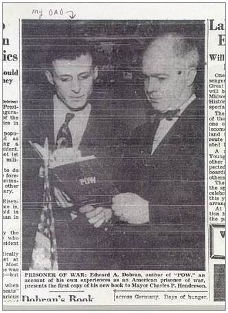 Edward A. Dobran presents his 'P.O.W.' book to Mayor Charles P. Henderson