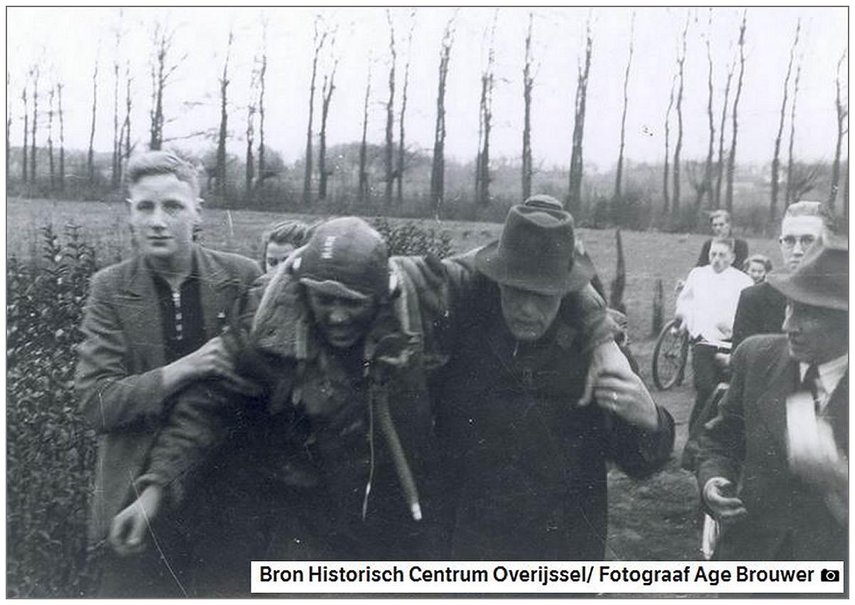 Injured S/Sgt. Harlan Shoemaker Mann supports by local residents - Tuesday 11 Jan 1944