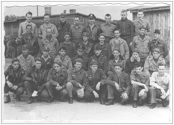 William 'Bud' O'Barr - likely in this POW Camp photo - front row at the right